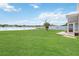 Tranquil backyard view overlooking a serene lake, providing a peaceful retreat at 2481 Deer Creek Blvd, St Cloud, FL 34772