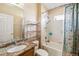 Bathroom featuring a granite countertop, a large mirror, a shower with floral shower curtain, and a toilet at 2481 Deer Creek Blvd, St Cloud, FL 34772