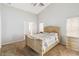 Bedroom with carpeted floors, a ceiling fan, and a comfortable bed with floral patterned bedding at 2481 Deer Creek Blvd, St Cloud, FL 34772