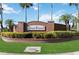 Welcoming Deer Creek community sign with lush greenery and brick detailing at 2481 Deer Creek Blvd, St Cloud, FL 34772
