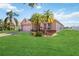 Inviting home exterior with lush lawn and vibrant landscaping at 2481 Deer Creek Blvd, St Cloud, FL 34772