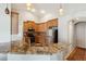 Spacious kitchen featuring granite countertops and ample cabinet space for storage and food preparation at 2481 Deer Creek Blvd, St Cloud, FL 34772