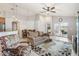Bright, open living room features neutral tones and access to the patio, seamlessly flowing into the dining area at 2481 Deer Creek Blvd, St Cloud, FL 34772