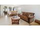 Open-concept living and dining area with neutral tones and bright lighting at 2481 Deer Creek Blvd, St Cloud, FL 34772