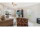 Cozy living room with ceiling fan and views of the backyard and patio at 2481 Deer Creek Blvd, St Cloud, FL 34772