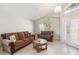 Bright living room with tile floors, vaulted ceiling, and plenty of natural light at 2481 Deer Creek Blvd, St Cloud, FL 34772