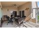 Sunroom with comfortable seating, ceiling fan, and views of backyard at 2481 Deer Creek Blvd, St Cloud, FL 34772