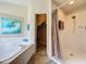 Modern bathroom featuring a soaking tub, a separate shower and a closet at 2641 Hemingway Ave, Haines City, FL 33844