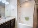 Bathroom with a shower-tub combination, modern vanity, and neutral decor at 2641 Hemingway Ave, Haines City, FL 33844