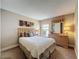 Bedroom featuring bed with a padded headboard, neutral walls and a mirror at 2641 Hemingway Ave, Haines City, FL 33844