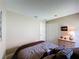 Comfortable bedroom with a queen size bed, dresser and neutral walls and carpet at 2641 Hemingway Ave, Haines City, FL 33844