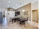 Kitchen dining area with decorative light fixture and bar stool seating at the island at 2641 Hemingway Ave, Haines City, FL 33844