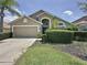 Charming single-Gathering home featuring a well-manicured front yard and a two-car garage, ideal for comfortable living at 2641 Hemingway Ave, Haines City, FL 33844