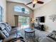 Bright living room with large windows overlooking the pool area and comfortable seating at 2641 Hemingway Ave, Haines City, FL 33844