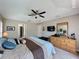 A main bedroom featuring a king-size bed, dresser and a walk-in closet at 2641 Hemingway Ave, Haines City, FL 33844