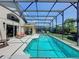 Beautiful screened-in pool with comfortable seating, offering an ideal outdoor living space for enjoyment at 2641 Hemingway Ave, Haines City, FL 33844