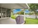 Back patio with lake views, a grill, and lush landscaping to enjoy the outdoors at 2658 Adele Pl, Lake Mary, FL 32746