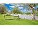 Scenic view of a serene lake from the backyard, featuring a dock and lush greenery at 2658 Adele Pl, Lake Mary, FL 32746