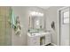 Contemporary bathroom featuring a sleek glass countertop and a vessel sink at 2658 Adele Pl, Lake Mary, FL 32746