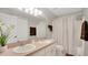 Well-lit bathroom featuring a double sink vanity and shower-tub combination at 2658 Adele Pl, Lake Mary, FL 32746