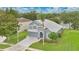 Aerial view of a charming two-story home with a well-manicured lawn and beautiful landscaping at 2658 Adele Pl, Lake Mary, FL 32746