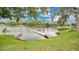 A picturesque view of the lake is seen, with a wooden dock and a kayak by the shore at 2658 Adele Pl, Lake Mary, FL 32746