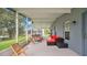 Spacious screened lanai with lake views, comfortable seating, and a tranquil setting at 2658 Adele Pl, Lake Mary, FL 32746