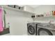 Functional laundry room equipped with modern washer and dryer units at 2658 Adele Pl, Lake Mary, FL 32746