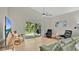 Living room boasts hardwood floors, vaulted ceilings, and sliding glass doors to the backyard at 2658 Adele Pl, Lake Mary, FL 32746