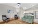 Bright living room with hardwood floors, comfy leather seating, and neutral paint palette at 2658 Adele Pl, Lake Mary, FL 32746