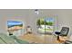 Living room featuring a sliding glass door to the patio and a scenic lake view at 2658 Adele Pl, Lake Mary, FL 32746