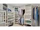 Organized walk-in closet with ample shelving, hanging space, and shoe storage at 2658 Adele Pl, Lake Mary, FL 32746