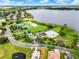 Aerial view of community amenities including tennis courts, pool, and lake access at 2710 Gorst Rd, Winter Garden, FL 34787