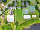 Aerial view of community amenities including a pool, tennis courts, and green spaces at 2710 Gorst Rd, Winter Garden, FL 34787
