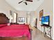 Spacious bedroom features tile flooring, a ceiling fan, and tasteful decorations at 2710 Gorst Rd, Winter Garden, FL 34787