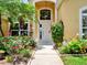 Charming front entrance with well-maintained landscaping and a bright white front door at 2710 Gorst Rd, Winter Garden, FL 34787
