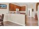 Well-appointed kitchen with bar seating, ample cabinetry, and modern appliances for cooking at 2710 Gorst Rd, Winter Garden, FL 34787