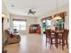 Comfortable living area with dining, casual seating, and tile floors throughout at 2710 Gorst Rd, Winter Garden, FL 34787
