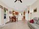 Open-concept living area with a blend of kitchen, dining, and cozy seating arrangements at 2710 Gorst Rd, Winter Garden, FL 34787