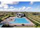 Aerial view of community pool with ample seating and a clubhouse, perfect for relaxing and entertaining at 2710 Gorst Rd, Winter Garden, FL 34787