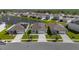 An aerial view showcases this community's serene pond and well-maintained lawns of the houses at 284 White Heron Way, St Cloud, FL 34772
