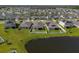Aerial view of new homes with solar panels in a Primary-planned community at 284 White Heron Way, St Cloud, FL 34772