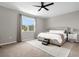 Bedroom with a large window, plush carpet, and a spacious bed, offering both comfort and style at 284 White Heron Way, St Cloud, FL 34772