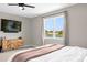 Bedroom featuring a window with a view, complemented by a TV and dresser for added convenience at 284 White Heron Way, St Cloud, FL 34772