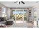Spacious living room with large sliding glass doors leading to a screened in lanai and backyard at 284 White Heron Way, St Cloud, FL 34772