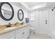 Bathroom with dual sinks, quartz countertops, and black hardware at 2903 Clear Way, Orlando, FL 32805