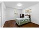 Bedroom with hardwood floor, single bed, closet and two windows at 2903 Clear Way, Orlando, FL 32805