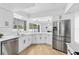 Modern kitchen featuring stainless steel appliances, sleek white cabinetry, and ample counter space for cooking at 2903 Clear Way, Orlando, FL 32805