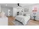 Bright main bedroom with a ceiling fan, wood floors, white walls, and access to ensuite bathroom at 2903 Clear Way, Orlando, FL 32805