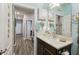 Bathroom with decorative wall hangings and light fixtures, showing a clean space at 2941 Marlberry Ln, Clermont, FL 34714
